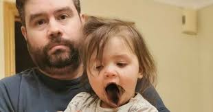 Artistic' toddler left looking like 'girl from The Exorcist' after  colouring in own tongue with black felt tip pen