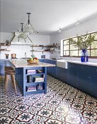 White marble tiles add to the light and airy feel in this compact kitchen. Commune Design And Granada Tile S Sofia Cement Tile In Elle Decor The Cement Tile Blog Kitchen Inspirations Kitchen Flooring Home Kitchens