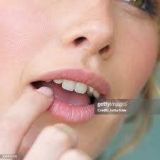 8.102 Finger In Mouth Stock Photos, High-Res Pictures, and Images