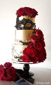 A Show Piece Gold Metallic Wedding Cake Featuring Rich Dramatic Black Accents Including A Custom Ma Metallic Wedding Cakes Masquerade Cakes Wedding Cake Recipe
