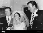 John Wayne right, at the wedding of Patrick Wayne, left, and his ...