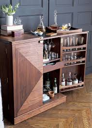 Framed in mahogany with a top and back panel made of hardwood with mahogany veneer. Bar Cabinet Modern Cabinet