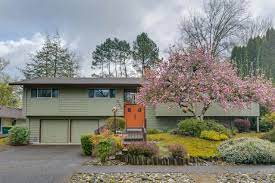 A split level house is considered a variation on the ranch house. Royal Woodlands Archives Living Room Realty