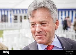 Alan Duncan MP, Minister of State for Europe and the Americas, walks along  Whitehall in Central London Stock Photo