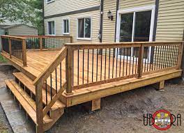 An outdoor deck is a great way to maximize your home's living space and connect the indoor living area with your backyard. Wood Deck With Black Metal Spindle Railings Terrasse Montreal Von Groupe Ubora Houzz