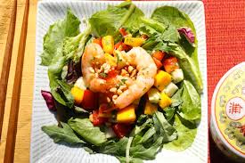 In a large bowl, toss together the cabbage, arugula and romaine. Thai Mango And Prawn Salad Katiechin