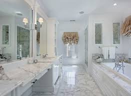 A farmhouse bathroom by dv rasmussen construction gets a chic touch with a subtle marble herringbone tile. Carrera Marble Bathroom