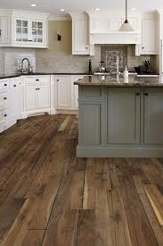 The combination of dark wood floors and hickory cabinets is excellent for creating a cozy atmosphere in your kitchen area. Can You Have Wood Floors In Kitchens Esb Flooring