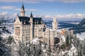 Aerial view of the neuschwanstein castle covered with snow during winter. Where Is The Disney Castle In Germany A Guide To Visiting Neuschwanstein Castle