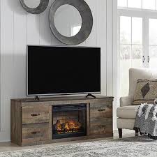 You should consider features while shopping for an electric fireplace, too. Signature Design By Ashley Trinell Electric Fireplace Tv Stand