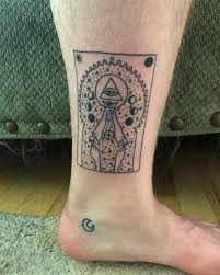 This with a hand holding a card design is simply a good piece of artwork. 25 Magical Tarot Card Tattoo Examples