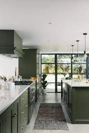 These nine spaces make a case for living colorfully. 9 Green Kitchens That Are Positively On Trend Hunker Green Kitchen Cabinets Kitchen Design Green Kitchen Inspiration