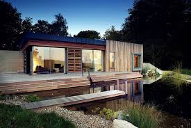 Contemporary house plans are characterized by an absence of any historical style, but instead incorporating art deco, retro, futuristic, and hi tech styles. Tranquil Forest House With A Sustainable Modern Design In The Uk