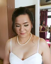 Makeup by Ann de Guzman added a...