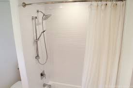 Utilizing a tight corner this small walk in shower made room for a small stand alone tub. Remodelaholic Pink Bathtub Makeover