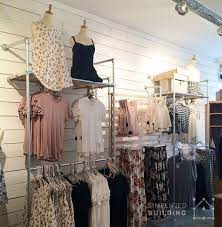 A bike hanger is the simplest type of bike wall mount, allowing the bike to hang vertically by attaching to the front wheel or horizontally by hooking on to the top tube. Wall Mounted Clothing Racks How To Use Them Effectively Http Www Simplifiedbuilding Com Blog Wall Retail Clothing Racks Clothing Rack Display Clothing Rack