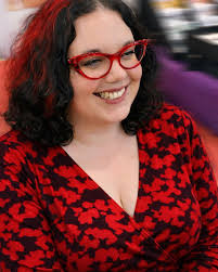 Cat-eye glasses will never date, and this gorgeous lady is absolute proof  of that. That bold red cat-eye frame, the confident smile, the way the  shape lifts and frames her face so