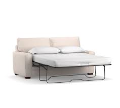 Distinguished by generous square arms and welted seams, this sofa twin sleeper has a luxurious feel. Pearce Square Arm Fabric Sleeper Sofa With Memory Foam Mattress Pottery Barn