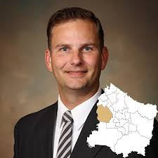 District 9 Commissioner