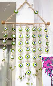 Handmade glass evil eye bead to decorate the walls of your home or workplace. Green Evil Eye Talisman Turkish Home Decor Accessory For Good Stock Photo Picture And Royalty Free Image Image 74673049