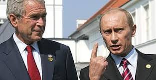 Putin and Bush hold rapid meeting to ...