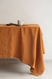 Unlike a tablecloth, measurements for a table pad protector should be equal to that of your table.suitable for cotton and linen tablecloths that stain more easily, a tablecloth protector can be layered on your tablecloth to help protect it against damage from hot pots and pans. Washed Linen Tablecloth Square Large Tablecloth Terracotta Etsy In 2021 Table Cloth Linen Tablecloth Large Tablecloths