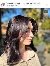 Who can recommend a haircut for long hair with layered cut and bangs?