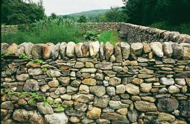How To Build A Dry Stone Wall Hunker Dry Stone Wall Stone Walls Garden Stone Retaining Wall