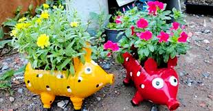 Pot, plants or cuttings, empty plastic water bottles, potting soil, pumice. Diy Recycled Plastic Bottle Piggy Planters Diy Ways