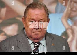 In this July 27, 2005 photo, FBI Agent Frederick Humphries, left, leaves a  news conference at the Federal Courthouse in Seattle. Humphries has been  identified as the agent socialite Jill Kelley contacted