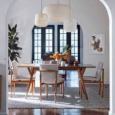 The modern expandable dining tables allow maximum coverage during parties and special gatherings. Mid Century Expandable Dining Table West Elm