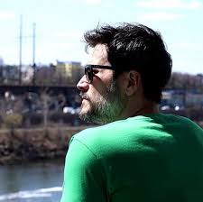 CB West football coach Mike Pettine, Sr. shakes hands with his son, North  Penn coach Mike Pettine, Jr.,