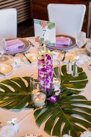 Liven up your space with our faux monstera leaf stem. One Of Our Tropical Centerpieces With Monstera Leaves The Other Tables Alternated Between Monstera And Palm Leaves Wedding Centerpieces Tropical Centerpieces Tropical Wedding Reception
