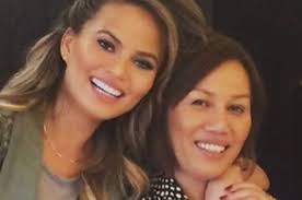 Pregnant chrissy teigen clutches baby bump in printed shirt dress. Omg Chrissy Teigen S Mom Is A Goddamn Icon