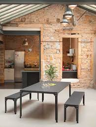 Two squared legs support the design, made from thick stainless steel and finished in deep black. Industrial Style Dining Table Hegoa Matiere Grise Thermo Lacquered Steel Galvanized Steel Rectangular