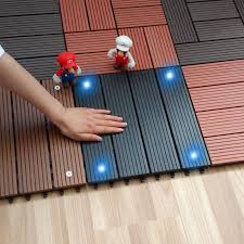 These tiles are a quick and easy fix for covering up that old cracked or unsightly concrete patio or balcony. Wood Plastic Composite Flooring With Solar Light Outdoor Garden Balcony Interlocking Decking Tile Wood Deck Patio Outdoor Solar Lights Outdoor Flooring