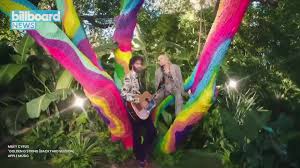To get the word out, miley teamed up with one of her biggest idols, joan jett, whom she recently inducted in the rock and roll hall of fame, for the first installment of the #‎happyhippiepresents‬: Billboard Miley Cyrus Rocks Tiny Flower Bikini For Backyard Sessions Version Of Golden G String Facebook