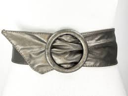 The silver toned belt buckle is filled with this belt is a unique piece to any collection and adds bling to any look. 1980s 47 Wide Silver Bronze Metallic Belt For Wom Gem