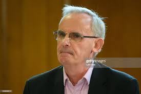 Journalist Ewen MacAskill addresses the other speakers and audience... News  Photo