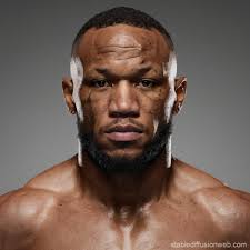 jon kahn fighter standing in a dimly lit boxing ring Prompts