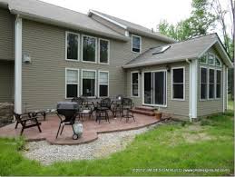 Sunroom Addition Twinsburg Oh Stamped Concrete Patio Off Of The Sunroom That S Perfect For Grilling A Concrete Patio Sunroom Addition Concrete Patio Makeover