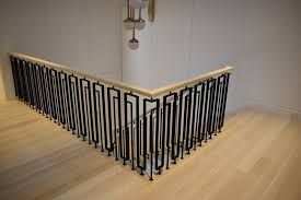 Drilling all the mounting plates after cutting. Stylish Nyc Home With Contemporary Railings Compass Iron Works