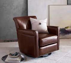 While our new collection of leather swivels and gliders may look attractive, it's comfort that matters most. Irving Roll Arm Leather Swivel Glider Polyester Wrapped Cushions Signature Chalk Amy S Living Room Swivel Recliner Chairs Small Recliner Chairs Chair
