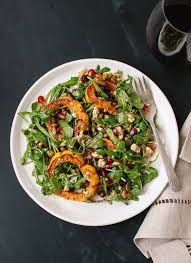 Roasted Delicata Squash Pomegranate And Arugula Salad Recipe Sweet Potato Recipes Fries Vegetarian Salads Arugula Salad Recipes