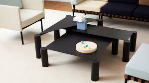 The thin coffee tables has an valuable purpose, it requires to hold glasses of coffee, newspapers, magazines, meals, food, even games consoles or media players. Max Enrich Creates Nesting Coffee Tables With Bulky Legs And Slender Tops