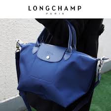 Longchamp Le Pliage Neo Available In 2 Sizes This Season The Le Pliage Neo Handbag Is A Seamless Combination Of Tr Longchamp Longchamp Neo Longchamp Le Pliage