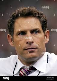 Former San Francisco 49ers quarterback Steve Young stands