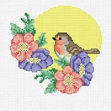 Free animal cross stitch patterns from cuddly cats to cute caterpillars, stitch a menagerie of creatures with our free cross stitch patterns cross stitch Robin With Flowers Cross Stitch Pattern Kruissteek Vogel Kruissteekpatroon Kruissteek Bloemen