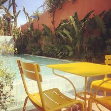 Fermob Luxembourg Chairs And Opera Tables At Musee Yves Saint Laurent In Marrakech The Vibrant Yellow Of Fermob S Honey Is Fermob Outdoor Living Outdoor Decor