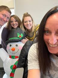 Holiday Fun at the office with Mark Beller Jamie Bernhardt Megan Verheyen  and the Ansay Snowman